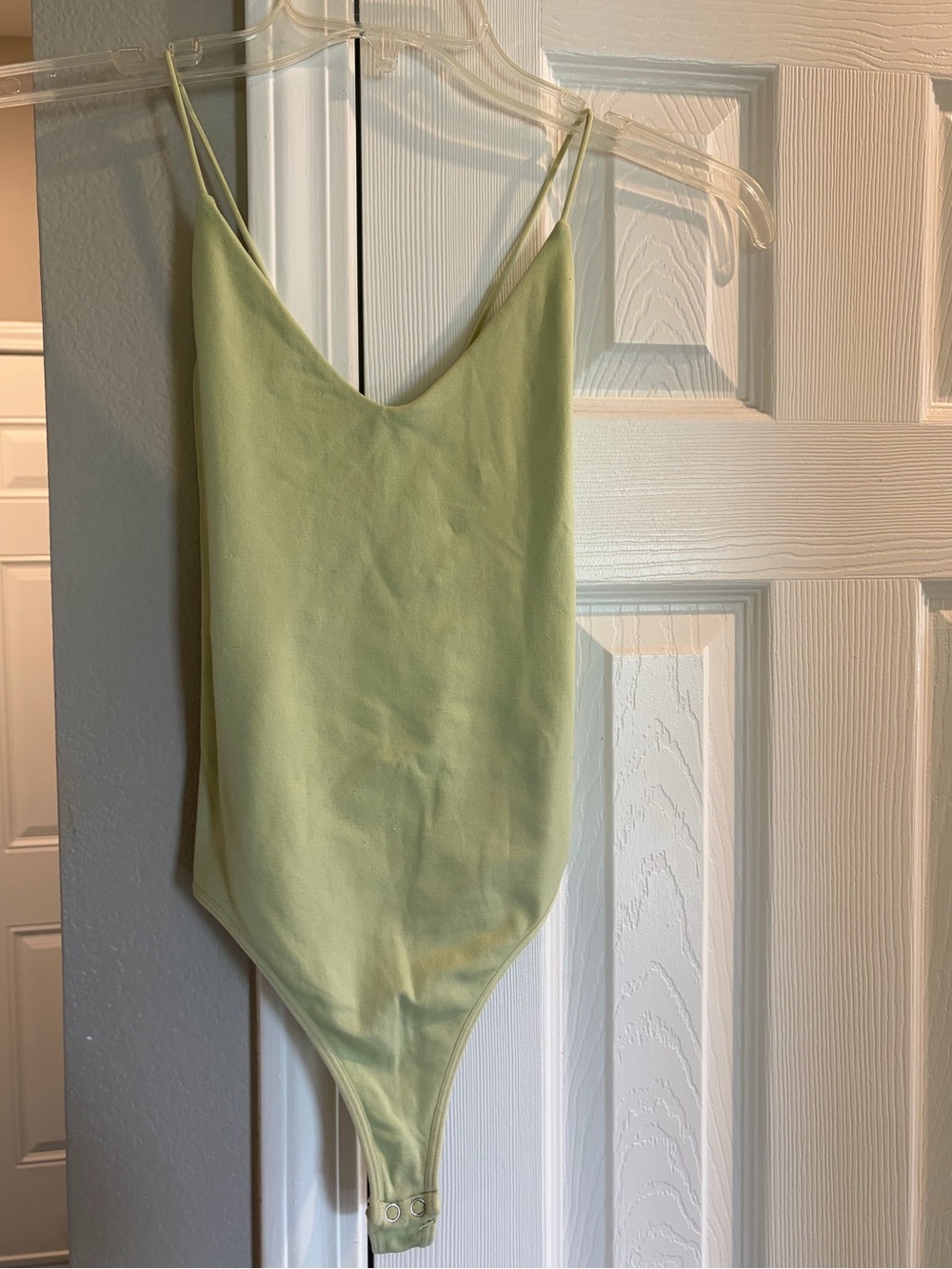 green open back body suit